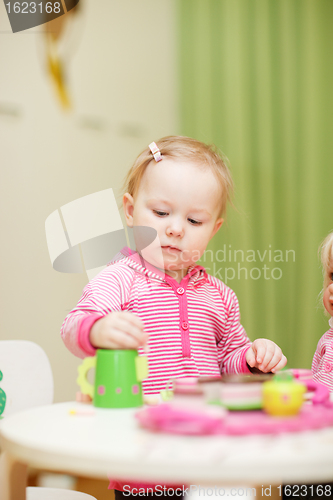 Image of Little girl playing with toys