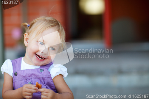 Image of Portrait of adorable playful girl