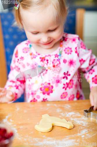 Image of Little girl baking cookies