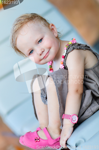 Image of Vertical portrait of happy toddler girl