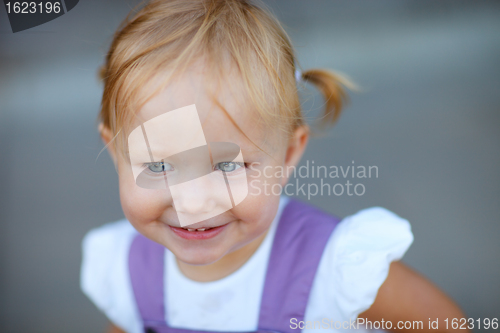 Image of Closeup portrait of adorable playful girl