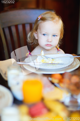 Image of Toddler girl having breakfast