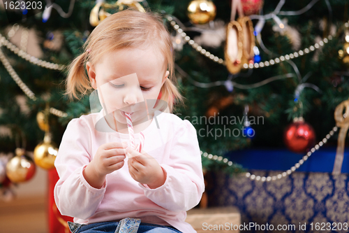 Image of Toddler girl with Christmas candy