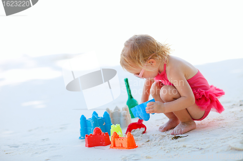 Image of Little girl playing at beach