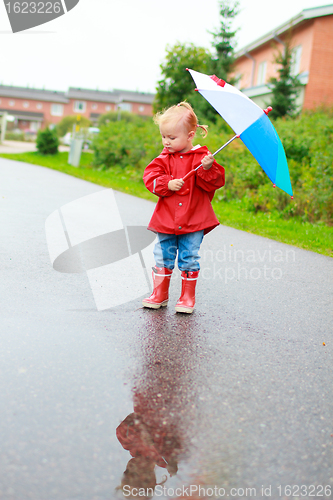 Image of Toddler girl with umbrella