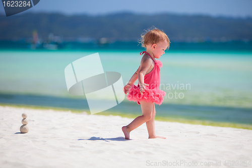 Image of Toddler girl playing at beach