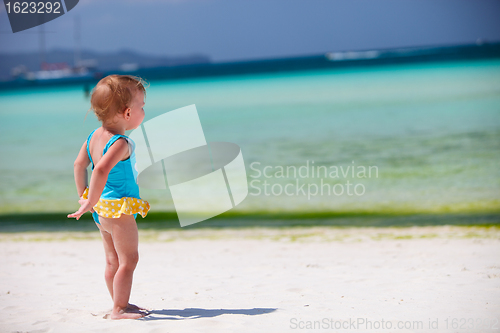 Image of Toddler girl at tropical beach