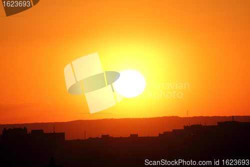 Image of orange sunset over town