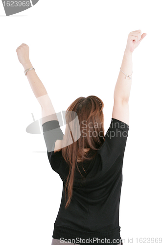 Image of Beautiful happy young woman with her arms in the air. Isolated o