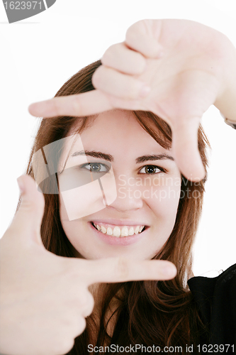 Image of Beautiful young woman creating a frame with her fingers 