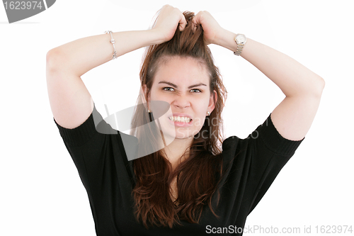 Image of Stress. Business woman frustrated and stressed pulling her hair.