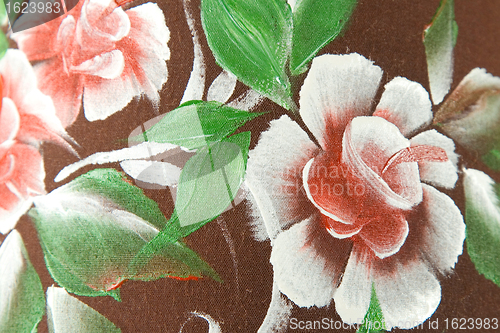 Image of flower print on brown fabric