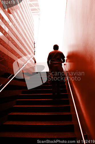 Image of Man climbing on the stairs