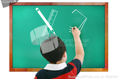 Image of Boy in classroom thinking, writing and counting on board
