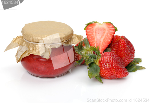 Image of Fresh Strawberries with jam-jar closeup