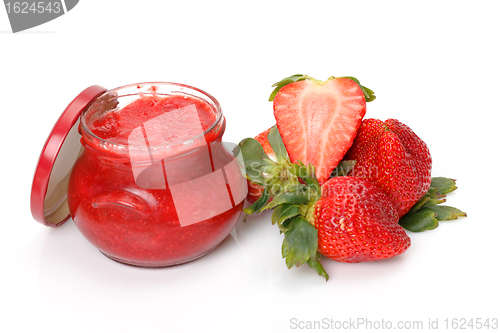 Image of Fresh Strawberries with jam-jar closeup