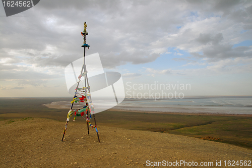 Image of Triangulation mark with buddhist prayer flags