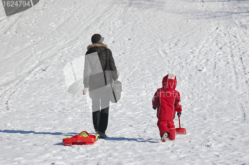 Image of Mother and child going to slide