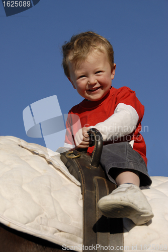 Image of riding little boy