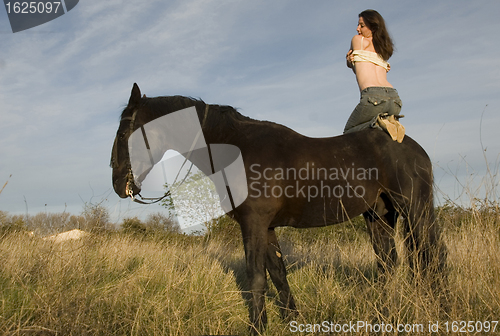 Image of sexy woman on horse