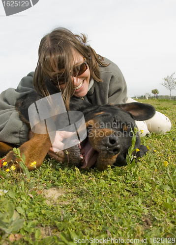 Image of smiling girl and dog