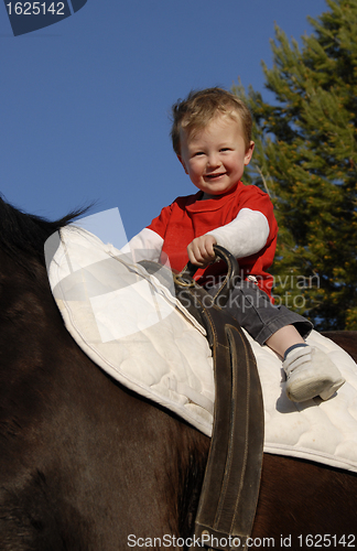 Image of riding little boy