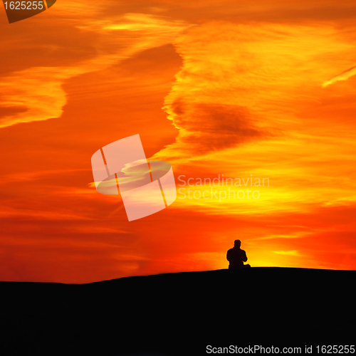 Image of Man on sunset background