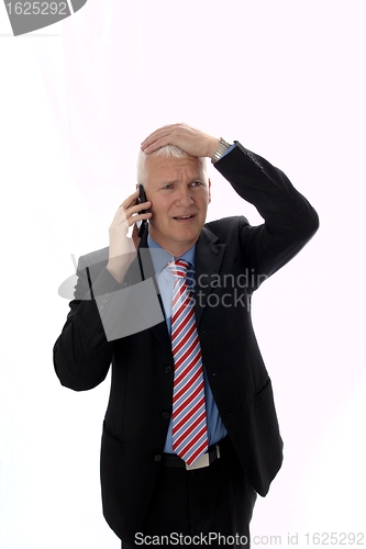 Image of Businessman disappointed calling Hand on head