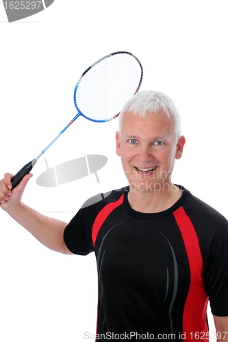 Image of Senior with badminton racket over head