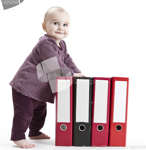 Image of young child with four file folders