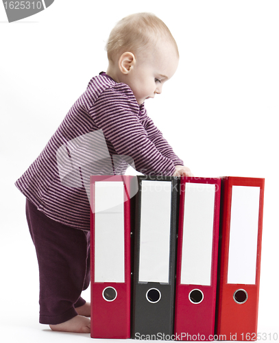 Image of young child with ring file