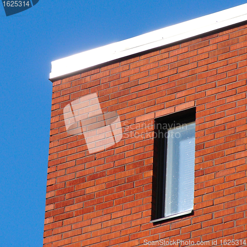 Image of Red wall and blue sky