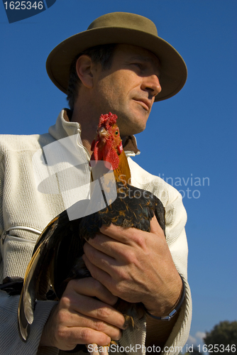 Image of man and chicken