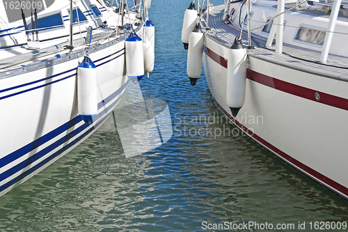 Image of Colorful motorboats on calm water
