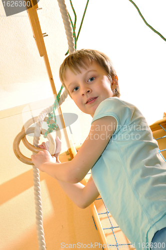 Image of cportive child playing at gym