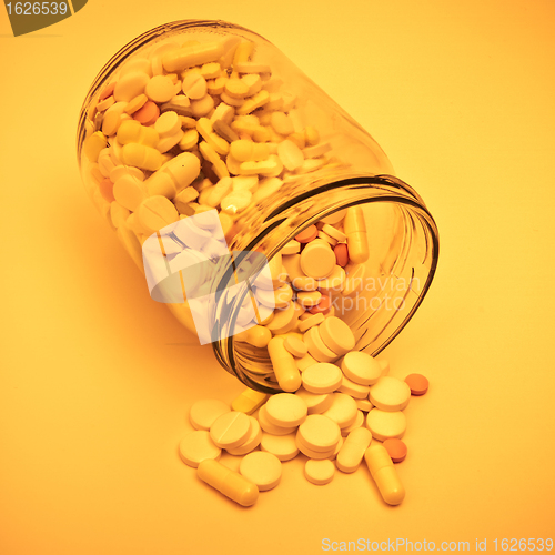 Image of pills in glass container