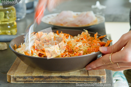 Image of chef making salad