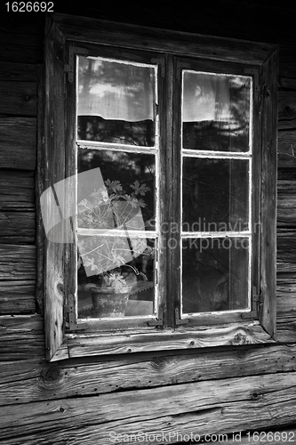 Image of window of old wooden cottage