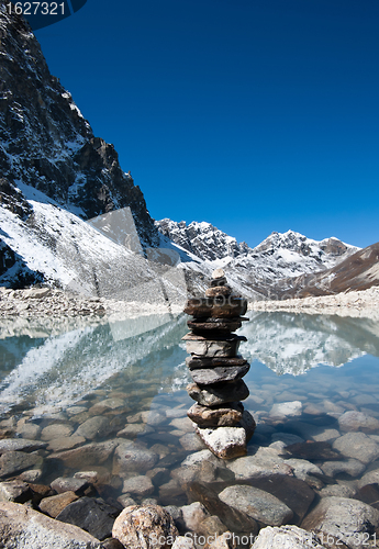 Image of Harmony: Stone stack and Sacred Lake near Gokyo