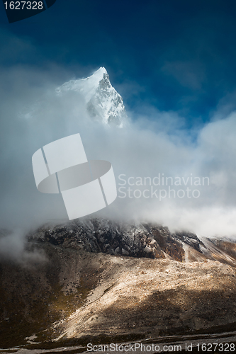 Image of Cholatse 6335 m mountain summit hidden in clouds