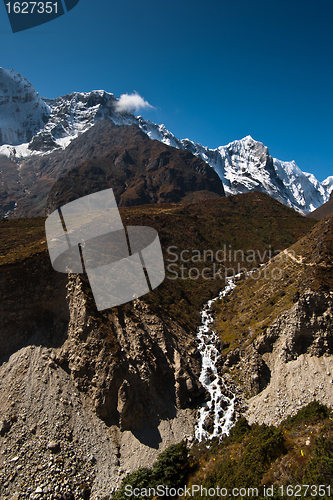 Image of Himalaya landscape: stream and snowed peaks