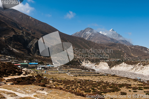 Image of Himalayas in Nepal: highland village and peaks