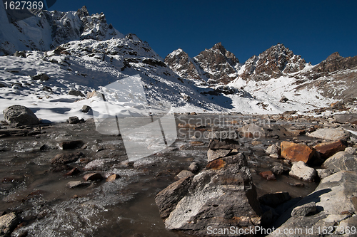 Image of Renjo pass: stream and peaks in Himalayas