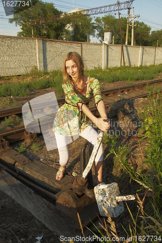 Image of Young woman on railway