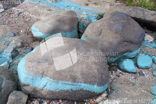 Image of Dirty stones at riverbank