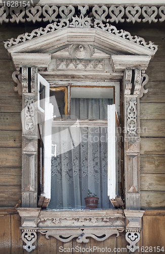 Image of Opened old wooden window