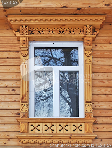 Image of New wooden window, decorated with carving