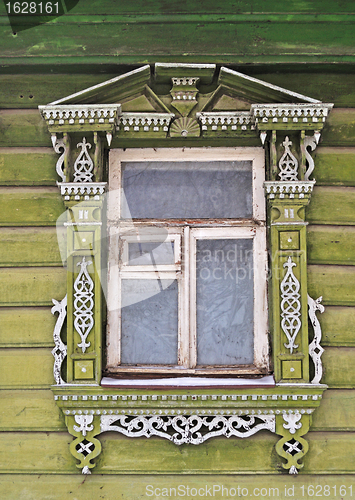 Image of Old wooden window, decorated with carving