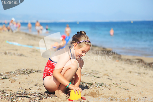 Image of Child playing on the beach