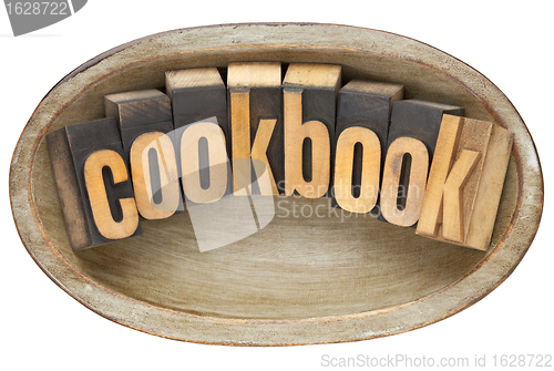 Image of cookbook in wooden bowl